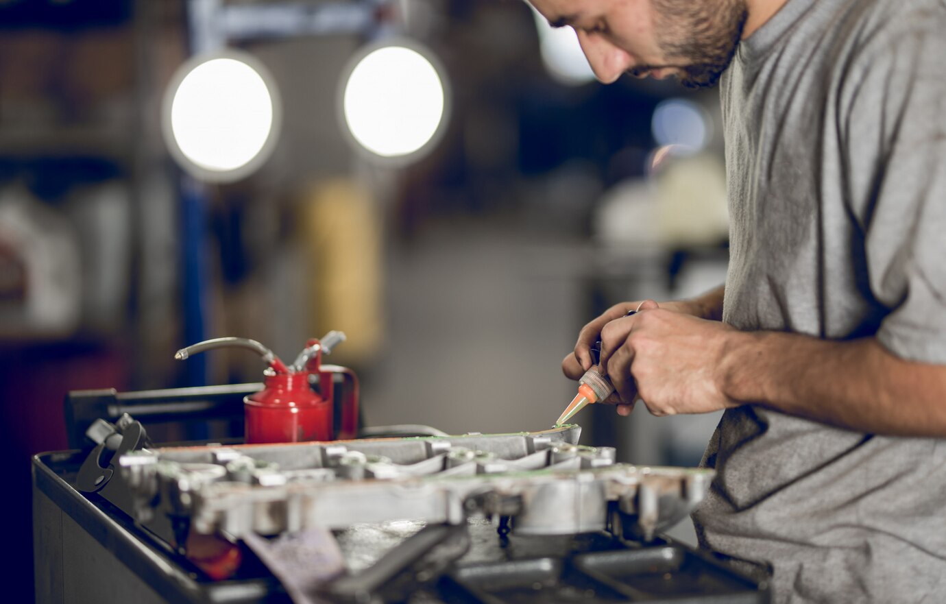 fellow benchman adding oil engine car_114579 2798