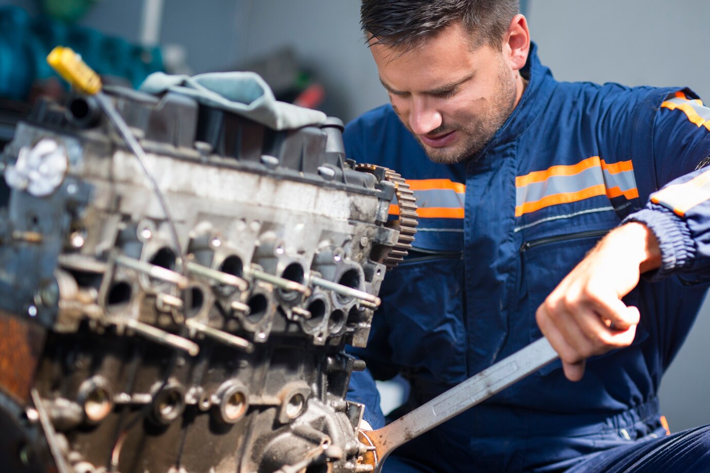 professional car mechanic repairing automobile engine using wrench work shop_342744 267
